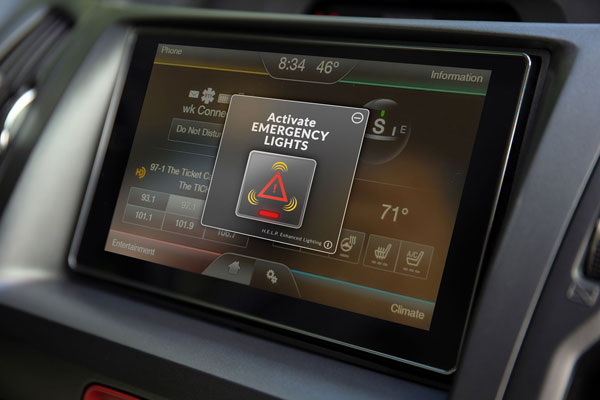 An image of the screen in the dashboard of a car alerting the driver that the VOXX HELP system has been activated and the emergency lighting is powered on to warn other drivers of a stationay vehicle.